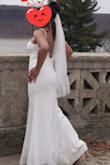 The dress is beautifulllllll. The material is thick but still have to wear nude underwear. The button details are what did it for me and the lace at the back, it wasn't too much because I didn't want a lace dress. It has layers. I've seen people accessorize with a belt and it still looked beautiful. My wedding was an intimate setting. It doesn't come with breast padding so I used the adhesive breast pad. If you're looking for something not expensive and worth the price, this is it!! - Lotoya D.