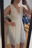 This dress is exactly what I was looking for our small wedding this spring. The material seems very high quality. It fits me perfectly. Some reviewers didn't seem to like the tulle layer in the skirt, but I think it looks great as is! Plus it has pockets! - Natasha M.
