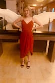 So far I am loving this dress! The only reason I say it is a little large is because I have a very small torso/middle compared to the bottom fit. But it was easy to fix with the adjustable straps on top. The slit hit perfectly (I am 5"5) and I wore it for the first time with some block heels. Perfect dress for a night out, dinner, or even a walk on the beach! - Hallie Q.