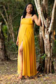This dress is beautiful and elegant with the mustard color and side split letting it stand out. No regrets purchasing it. - Sharlene J.