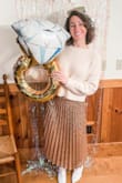 Wore this skirt with a pink sweater similar to the model photo! It was perfect for a cute get together with friends for NYE! purchased a small and it fit well - Kate T.