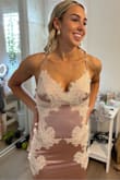 My daughter absolutely loved the fit, feel, and elegance of this dress! She's tiny and could have fit in a size zero if they had it but the lace up back helped it fit her better. It is really fabulous quality and even more beautiful in person. It is made long for the mermaid effect for pictures. We are thinking of adding a hook to shorten it for dancing purposes. - Yvonne P.