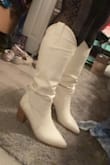 Ahh, these are so beautiful in person! The perfect height and fit. I have a wider calf and these still fit great. I sized up for the space and have a bit of room but they're comfortable. - Brittany D.