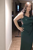 I received so many compliments while wearing this! More importantly, I felt amazing and confident (nothing needed to be adjusted the entire time) while wearing it. I can't say enough good things about this dress - the color is exactly as pictured, and the fabric is thick enough to not require body shapers. I wasn't sure about the size, so based it on my hips, but could have worn the large for a more fitted look. It was a few inches longer than I would have liked. I wore it as is, but plan to have it altered for the next time I wear it. Sitting was the only challenge due to the slit. - Sabrina U.