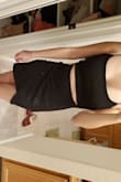 I bought this dress in black and glitter blue. Both dresses fit perfectly and the material is stretchy and comfortable. The material was also thick enough that any panty lines were hidden! Would definitely recommend these dresses. - Tu V.