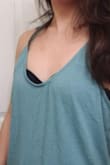 This doesn't wrinkle easily. I've left this in a pile of laundry for weeks and this is what it looks like after all that. It's also not sheer, so you don't have to worry about wearing extra layers underneath. You can't see the other parts of the black bra under the fabric. - Gabrielle