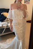 I've tried on a ton of dresses, and this one is finally the "boho" vibe I was hoping for! It is sexy, unique, and the train makes it very elegant. The lace detail and color are so beautiful. For me, the side zip was a little tight and uncomfortable, so I went with a large, and now it fits perfectly! I think I finally found my wedding dress! - Savannah T.