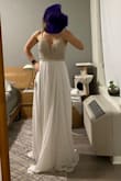 Beautiful simple looking dress. It fits like a glove but it did not speak to me. I thought maybe to cut it to the knee and wear it for a legal ceremony, but I decided to return it. It's nice but I would like something else for the actual ceremony. - Olesya P.