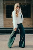 I got this in a small before I got the extra small. I could have worn the small, but it was a bit loose in some areas so I sized down. It is super comfy, flattering, and unique! The length is perfect too! I can wear it with any shoe really. - Lawren J.