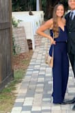 This jumpsuit is beautiful. I'm 5'5" so it's a little shorter than I'd prefer with heels - but still looks great! And definitely fits true to size. - Allysun S.