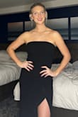 I loved this dress. I typically order a size large due to my height, but I read some reviews and decided to order down a size. This was totally the right decision. The grips on the upper portion were helpful but I feel as though I could have maybe worn a small even.. size down for an average to comfortable fit, size down potentially two for a form-fitting or "sucking" in type of feel I'd say? Overall: great dress, extremely comfortable and got so many compliments! For sure will be wearing it again in the future :) - Samantha F.