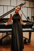 I bought this dress for my senior photos! It was long on me, but I had it altered. A little loose in the chest area. The skirt was so pretty for my photos; it flows neatly when you move. Really simple, but the back is a statement on its own (and you get to show off sports bra tan lines!). I have a pretty rectangular, athletic body but the movement of the skirt gave the illusion of curves :). Definitely can (and will) wear this for any more-formal events. - Sophie W.
