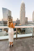 Loved this backless dress! The high neckline and midi length made it more elegant and the open back added just the right amount of sexiness for a great date night look! - Kathleen