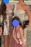 The dress was absolutely stunning esp for the price! I sewed in cups and boning on the side seam and under the cup on the strapless side because I didn't want to be pulling my dress up all night. So many compliments and I felt like a movie star. Had no issue with sequins rubbing! - Meredith T.