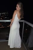 This dress SURPASSED expectations.
For sizing, read reviews! I ended up purchasing an XS (which I would normally NEVER do) but it gave me the tight fit I was looking for.  
Storytime: I had already purchased a beautiful (expensive) wedding gown and had buyer's remorse because it was more extravagant than I felt comfortable wearing and was worried about getting it dirty during dinner or dancing afterward- I purchased this dress as my "courthouse dress" and expected that it would be my "second gown"  on the wedding night. I bought it for about $75 during the Black Friday sale, which was an incredible deal for a budget bride. The dress arrived QUICKLY - extremely important since I ordered it the month before! 
I would highly recommend this dress to anyone - the button detailing on the back is beautiful, the small lace at the chest is subtle but sweet, and the low back plus a STRUCTURED fit made me feel like a star. I wore spanks and a sticky bra and I felt so good in it, even after drinking all day. GET THIS!! - Kristi K.