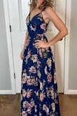 This dress is beautiful. It's a true wrap dress with lots of fabric to completely cover you and not worry that your leg will pop out when walking. I have to wear 3" heels for it to just barely hit the floor, so it is long. I feel very comfortable in this dress. I'm pretty tiny in the chest and finding dresses that fit well enough is a challenge. But using a sticky push-up works well underneath. I highly recommend this dress! - Jessica E.