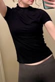 This shirt is very tight/small and it is somewhat thin. I ordered an XS and a S because I'm usually an XS in Lulus tops. I only tried on the S. It was tight on the body and my head barely fit through the head hole. It squished my face and pulled my skin and hair in an almost comical manner; there was almost no stretch. I will be returning both sizes. I don't think sizing up will help because the fabric won't have any more stretch. (It is smooth to touch though). - Sara M.