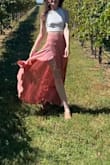 Bring a steamer with you because this somewhat thin fabric will wrinkle in transit but other than that this skirt is great! It is high-waisted and feels good on. - Sara M.