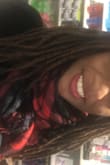 This scarf is so soft and the colors are so vibrant. I had to YouTube the different ways to wear this scarf but I love it! Red lippie makes it POP! I had a mask on before the pic so my lipstick is not as bright as it was but still, you get the point. - Shemel T.