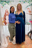 I wore this at 31 weeks pregnant for my baby shower and absolutely loved it. I felt like all the maternity stuff I tried looked like a moomoo so I tried this in a large (I would normally be a small) and it was perfect. It was plenty long and very comfortable. - Kristin F.