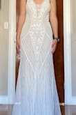 Very pretty dress. Nice details and very flowy at the bottom. Wasn't the color or as fitted as I wanted for a wedding dress. - Lydia C.