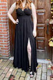 I wore this as a bridesmaid dress, and I got a lot of compliments! The dress was super comfortable and the material was heavy-duty and felt high quality (especially for the price). I have a larger bust and it definitely showed some cleavage, but not too much. :) Plus I could wear a regular bra with it which was great. I would definitely recommend this dress! - Phoebe P.