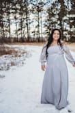 The dress is beautiful! I love the material and everything about it. - Smaly C.