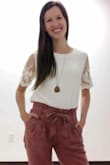 I own this top in black and it has been one of my favorites for a long time. I finally got around to ordering a second one in white and I love it just as much. The quality is excellent. The material is well made and the detail on the sleeves is so lovely. The shirt is nicely lined, so you don't have to worry about it being see-through (what a relief for white especially). High recommend. It's going to be hard for me not to buy it in every color. - Tori R.