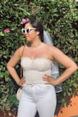 I loved the look of the top but difficult to wear with a bra. Would have been better to size down probably. - Courtney S.