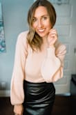 I really like this turtleneck bodysuit as it tucks perfectly in so many bottoms (gotta love wearing a long sleeve that doesn't budge while tucking it). There are lots of sticky bras that you can wear or bra hacks that you can do in order to feel comfortable with the open back - this works for me as I'm a 34B. - Erin T.