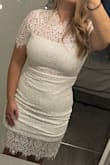 I love the dress and its so flattering. I was nervous the sleeves were going to be uncomfortable but they're not at all. I normally order dresses in a medium but based other reviews I ordered large and glad I did - Sarah M.