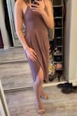 Wore this to a wedding and loved it! I was very close to being between sizes (depending on my weight changing a few pounds was recommended either medium or large). I went with the medium and am so happy I did! It fit perfectly without being too tight. 
The slit is a little high for a beach wedding due to the wind, so I would recommend wearing shorts/spandex underneath (that's what I'll be doing for the next one!) 
Paired this with a shawl/wrap to stay warm but definitely would pair it with a Jean jacket and some sandals for brunch! 
It was a bit wrinkled when it came - so definitely plan time to dry clean/unwrinkle before your event! - Sam H.