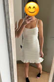 I put this on the first time and planned to return it because it is extremely fitted. But when I tried it on again I changed my mind. It is just like the photo but the material rides up a decent amount. Fairly comfortable but definitely shows everything. Planning on wearing it for a night of my bachelorette. The only other thing to note is the ruffle at the bottom juts out a lot. I'll probably try to iron it down a little. - Abby A.