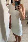 It's a beautiful style, I thought it would be too long for my height but it fits perfectly, maybe an XXS would have been better, but I love the way it fits. My only concern is that one shoulder only has one stitch and I feel is going to fall apart. - Majo S.