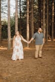 I wore this dress for our engagement photos and I loved it! It was a little bit tight on the bust, which doesn't usually happen with me. It made the dress a little low cut, but I still loved the way it felt and looked on me. Just be conscious if you are looking for something a little more covered. I am 5'4 and wore with sandals and the length was great. - Hannah B.