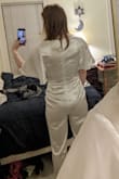 Really like this jumpsuit and it ALMOST fit well. As some other reviewers noted it was strangely baggy in the waist, but otherwise quite snug all around, so I don't think changing size in either direction would help. If I lift my arms the slack in the waist goes away, and there is very little stretch (if any) in the material, so altering it to remove the extra fabric in the waist would probably end up with it ripping at some point. Thought it was very comfortable and cute so I am sad to return :( For reference I am normally a small in tops, a 28 in jeans, and a 6 in dresses and purchased a small. - Katherine B.