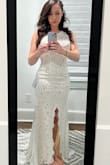 I am completely in love with this dress. It's just as gorgeous as the overpriced versions of similar wedding dresses, but this one is actually comfortable. It's soft to the touch, doesn't wrinkle, and fits snugly in all the right places. I got a small - I wear size small in all clothing - but I am a bit on the muscular side. For ladies on the slim side, I would say to go smaller. I will probably need slight alterations in the halter part of the dress, but that's bc I have a shorter torso. Otherwise, the dress is proportioned well and fits like a glove. My wedding is still a few months away so I'm eager to see how the train works out (it's quite long) but I highly recommend this dress. - Katie B.