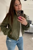 I love this jacket! It's decently warm but it's not a heavy-duty snow jacket or anything. It's fitted but true to size. - Mackenzie S.