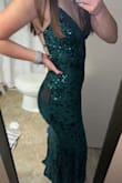 I absolutely love this dress! Bought it for prom in a few months and I'm so excited. It fits great I have larger legs and butt and average waist and small boobs so I ordered a small and it fits great on the bottom and the tie in the back helps make the top fit. I am 5'8 and it's a little long even in heels so if you are shorter you may have to get it altered. The only problem I have with it is just that the sequins scrape your hair when you brush your dress but that isn't an uncommon problem with sequin dresses. Overall so pretty and highly worth the price!! - Lucille R.