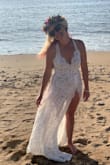 Considering I planned my wedding in 2 weeks and one of them was during an insane winter storm where we had no power for 10 days. It was lost in my town for 5 days before showing up 2 days before leaving for Hawaii! 
I put it on and it fit like a glove!! It is so beautiful! Great quality!! I didn't want to take it off!! My husband was jaw dropped! It was everything I have wanted!! The slit is high and sexy! The bodysuit is thick and comfortable! The thin straps scared me to get into by myself but they're strong and secure!
I couldn't be any happier! I'll probably wear it again when we have the party with everyone!! - Carlymae P.