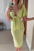 This dress is super cute! The material feels like light linen. The only reason I'm up in the air about it is that it's pretty tight on my hips, granted, I have a very small waist and quite wide hips. - Katy R.