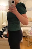 This runs small but it's flattering and the fabric is nice and thick in a good way. Kind of like a thinner taffeta. Beautiful color, has a side zip which is nice and keeps you sucked in. I would say it's probably not ideal for anyone with a large chest, as it'll smush your boobs. It does that for me and I'm only a B. Would love this in black. - Jessica B.