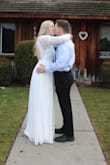 I wore this dress as my wedding dress. It is so beautiful and has such a classic look to it. The open back is stunning. The material is very high quality, nothing "cheap" about it. It does run large. I ordered a large and it was way too big. It was even too long which is rare for me, as I'm 5'10 (180 lbs.) I had it altered to fit me. The arms were long enough but I thought they were an awkward length on me, so I had them tightened and shortened a bit. I think I could have gotten away with a medium. I'm so in love with this dress, and couldn't picture myself eloping in anything else! - Shelby M.