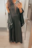 This was the perfect sexy/flirty yes classy and understated dress for any formal occasion - work events, weddings, etc. I am 5' 7", 120lb, and 32D, and I ordered a Small. I'm very slender so I expected it to be a little loose around my waist as it is not a fitted dress. Other than that, which was very minimal, it is very true to size. It is long and I had to get it shortened 3" so I wouldn't trip over and wore it with 4" heels. The fabric is so soft and lined so I was actually pretty warm during a very cold January night! - Taylor B.