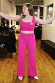 There wasn't my size in the pink color and I absolutely loved the pink color compared to the red. I ordered a small and a medium in the red just to try it and also ordered the pink in XL because it's all they had. Honestly, I could have done an XS in the top and a medium in the pants - for the red set. But I really loved the pink more and all they had was an XL so I ended up keeping that one and just getting it altered to fit me perfectly. So so so fun to wear this outfit though! Got so many compliments! And love the material, thick but stretchy enough. Good to wear for both winter and spring - Juliette B.