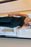 This jumpsuit feels expensive. It has a liner under so it sucks you in. I wore it with no bra and made no alterations. Although is a bit longer than I like (even with 4" heels), I'm only 5'2" and got for a last minute even. The straps are adjustable and I couldn't be more pleased - Monica U.