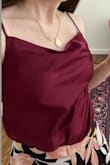 I really like this top, it feels more appropriate for my age (24) than the tight t-shirts I usually wear out. The color is gorgeous and rich. I love that the straps are adjustable so I can change the neckline to be higher or lower for different situations. The only issue is that you really only can wear this with high-waisted bottoms because the "underwear" portion of the body suit comes up so high. It's still a great top, but just keep that in mind when you buy it :-)! - Annie S.