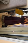 I am typically a medium but the dress is slightly big around the shoulders which makes the dress slightly loose but I wouldn't size down. I did have to get it altered because it was slightly long for my height and heels didn't make much of a difference but I love it! It's such a nice gown and is really flowy. The slit is in the center which makes it a bit awkward. That's the only thing I would change about the dress, the slit should have been more towards the side. - Renee R.