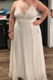 I wanted to buy a cheap wedding dress that would get the job done and make me feel pretty. This dress is great!!! I'm having alterations done as even with my wedding shoes it's a little long for me. I don't love the adjustable straps just because they can be unreliable, so I am also having the straps made stationary, but this dress is great!! - Emily M.