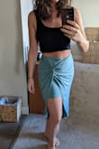 I really like this skirt; the color, material, and design. It seems like the waistband could flip and twist internally if care isn't taken while washing. I have a difficult time buying jeans/skirts that fit my waist, butt and thighs. I have a big, wide butt so form fitting skirts are NEVER an option. This skirt is more tolerant of curves than other skirts I've tried on. The M fits my waist really well while I could still use some more room in the hips. The under layer rides up some but I think a L would not fit my waist. There's just enough flair in the outmost layer that it's not too fitted on my behind. If I really wanted the best fit, I would get a L and have the waist taken in. - Alisa R.